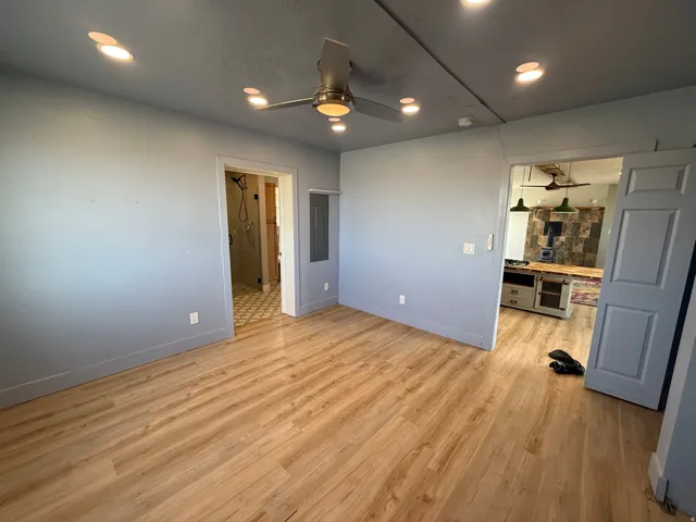 Unfurnished bedroom featuring light wood-type flooring, recessed lighting, and ceiling fan