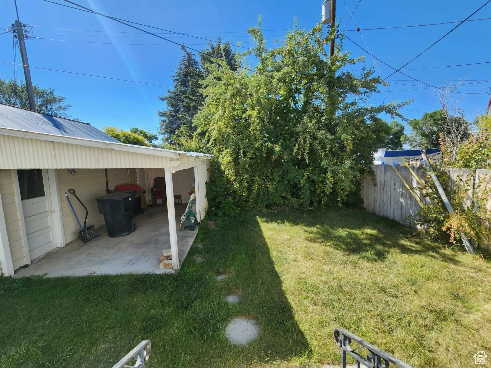 Fenced backyard with a patio