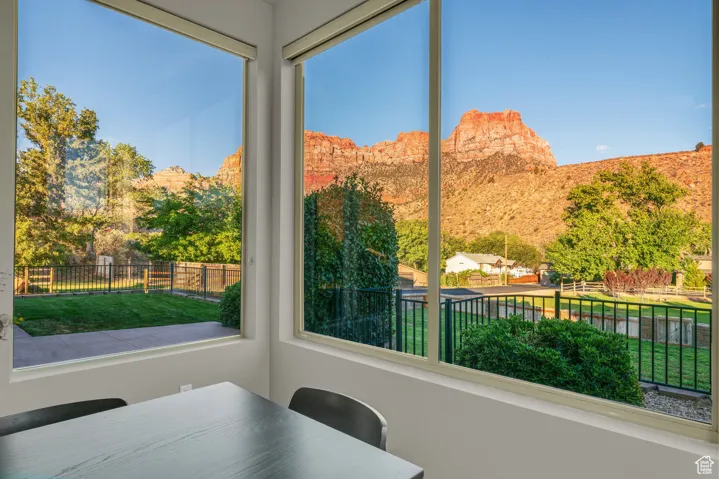 Sunroom / solarium with a mountain view