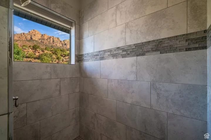 Bathroom view of a tile shower