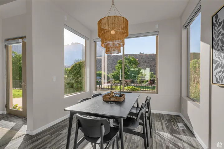 Dining space with a chandelier, healthy amount of natural light, and a mountain view