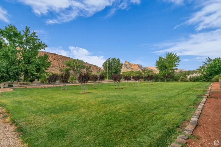 View of yard with a mountain view and a view of rural / pastoral area