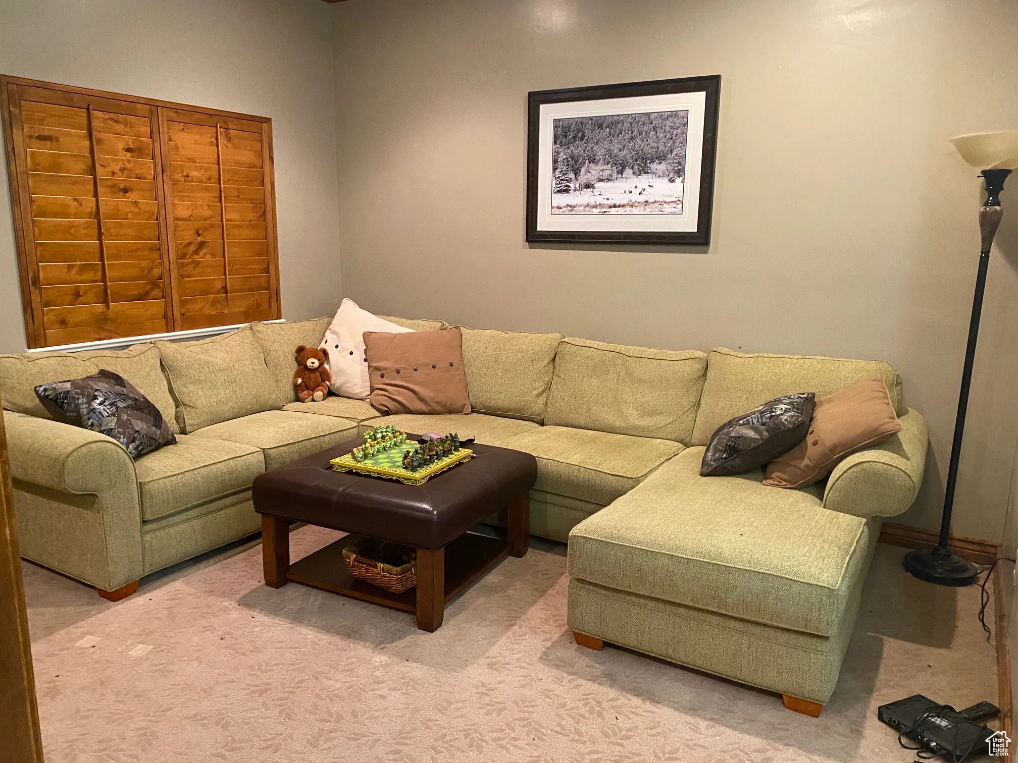 Living area with light colored carpet