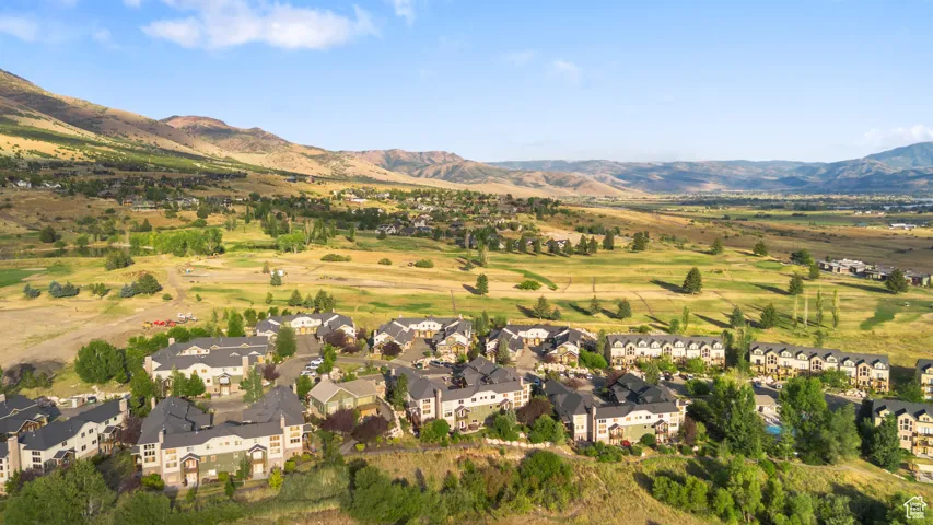 View of property location with nearby suburban area and a mountainous background