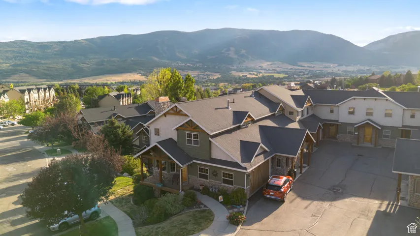 Aerial perspective of suburban area with a mountainous background