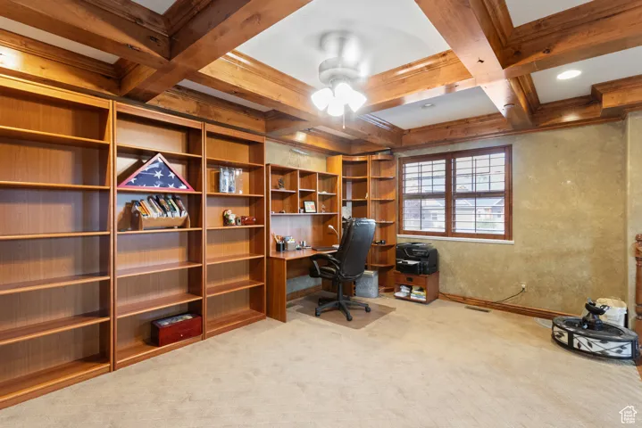 Office featuring carpet, beam ceiling, coffered ceiling, and ceiling fan
