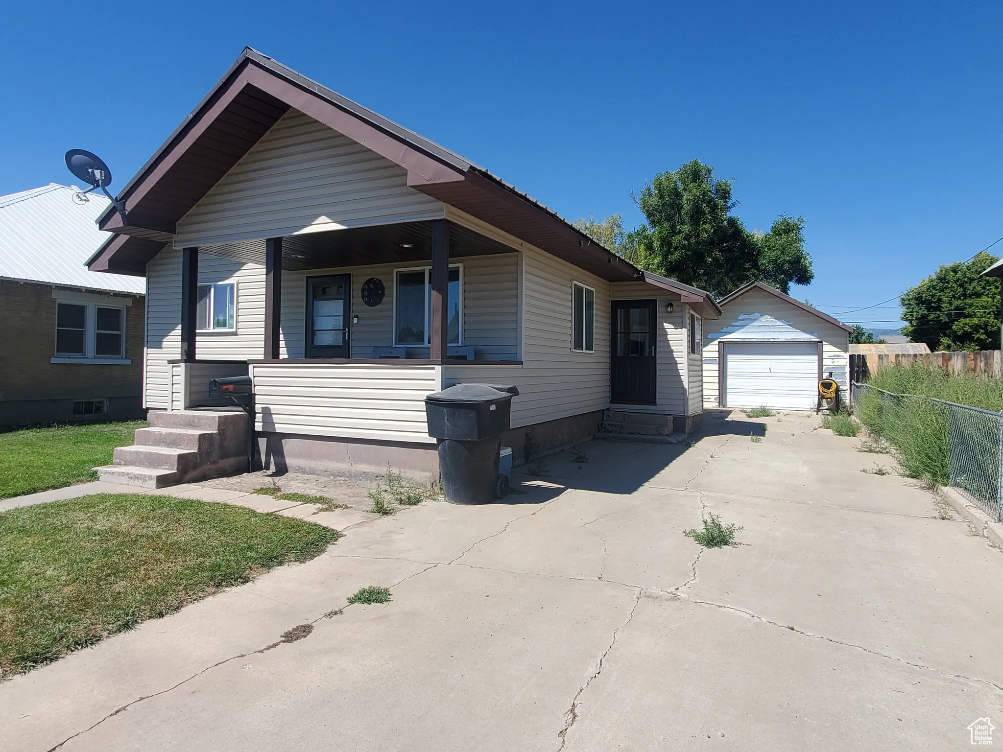 Bungalow-style home with a garage, , and covered porch