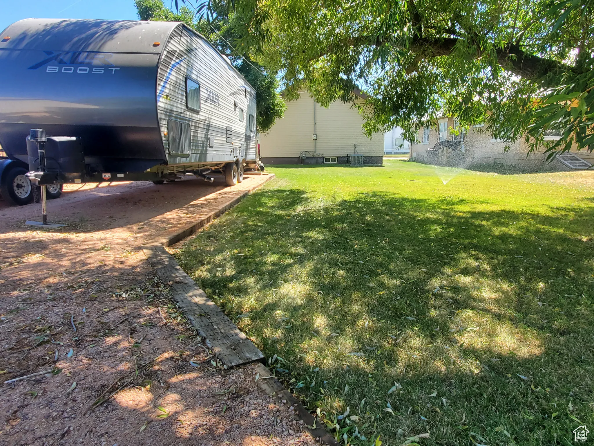 View of grassy yard and RV Parking