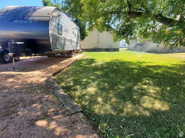 View of grassy yard and RV Parking