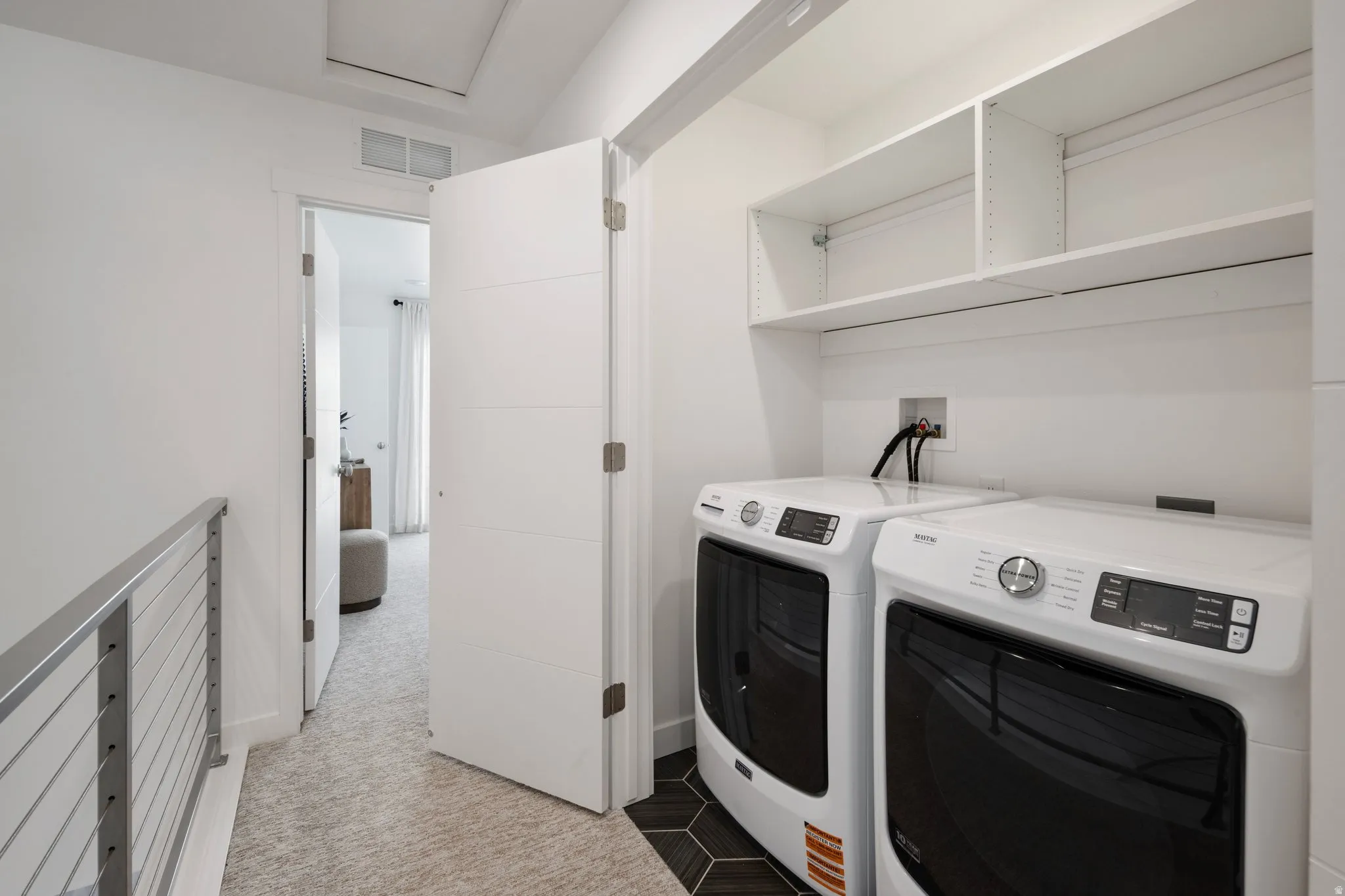Out of sight but never out of style. This laundry space is as practical as it is polished.