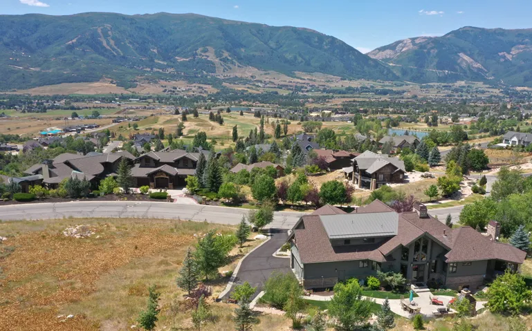 Aerial view of residential area featuring mountains