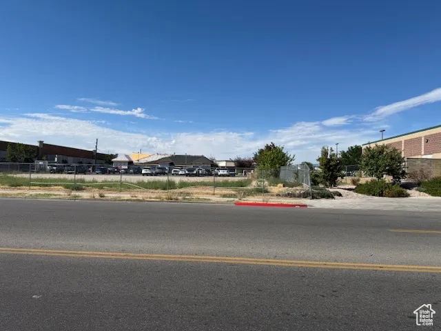 North view road featuring sidewalks and curbs