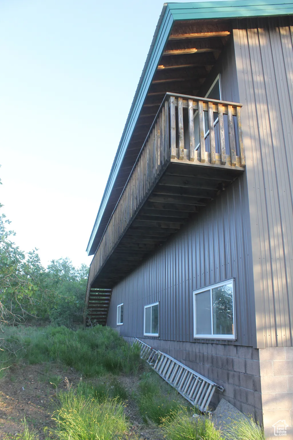 View of property exterior with a balcony