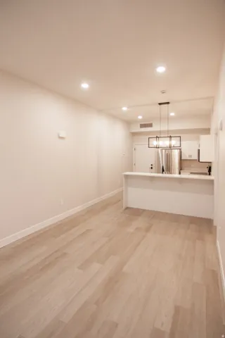 Unfurnished living room featuring recessed lighting and light wood finished floors