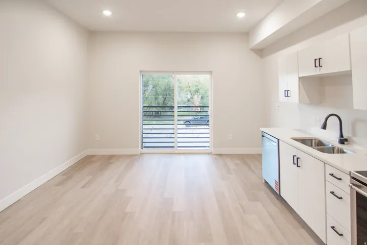 Kitchen featuring white cabinets, recessed lighting, light wood finished floors, and appliances with stainless steel finishes