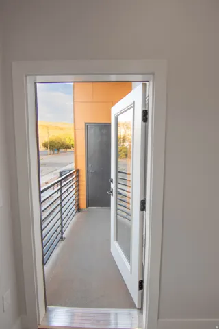 Entryway featuring carpet flooring and healthy amount of natural light