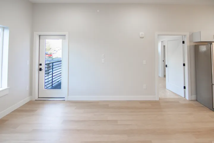 Spare room with light wood-style floors and baseboards