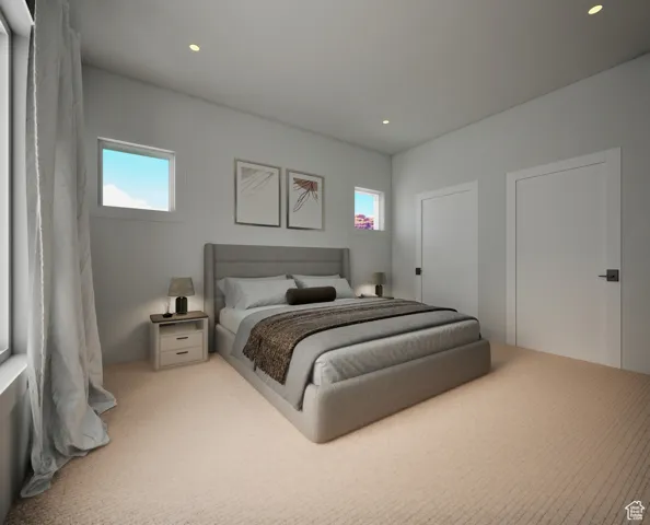 Bedroom with recessed lighting and light colored carpet