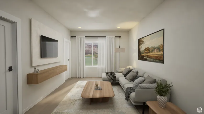 Living room featuring light wood-style flooring and recessed lighting