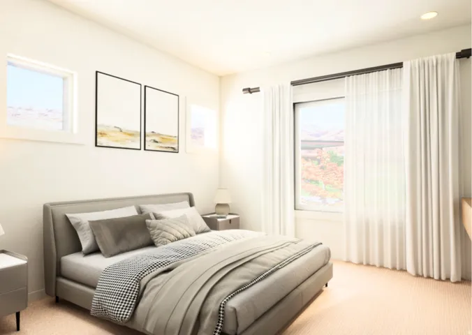 Light-filled room featuring white walls, recessed ceiling lighting, and soft-toned carpeting