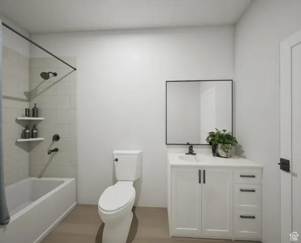 Bathroom with shower / washtub combination, vanity, and light wood-type flooring