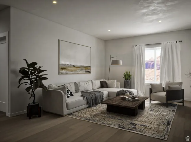 Living area with wood finished floors and recessed lighting