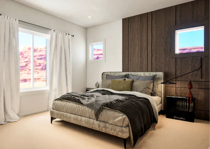 Bedroom featuring a textured accent wall, recessed lighting, two windows with white trim, and light beige carpeting