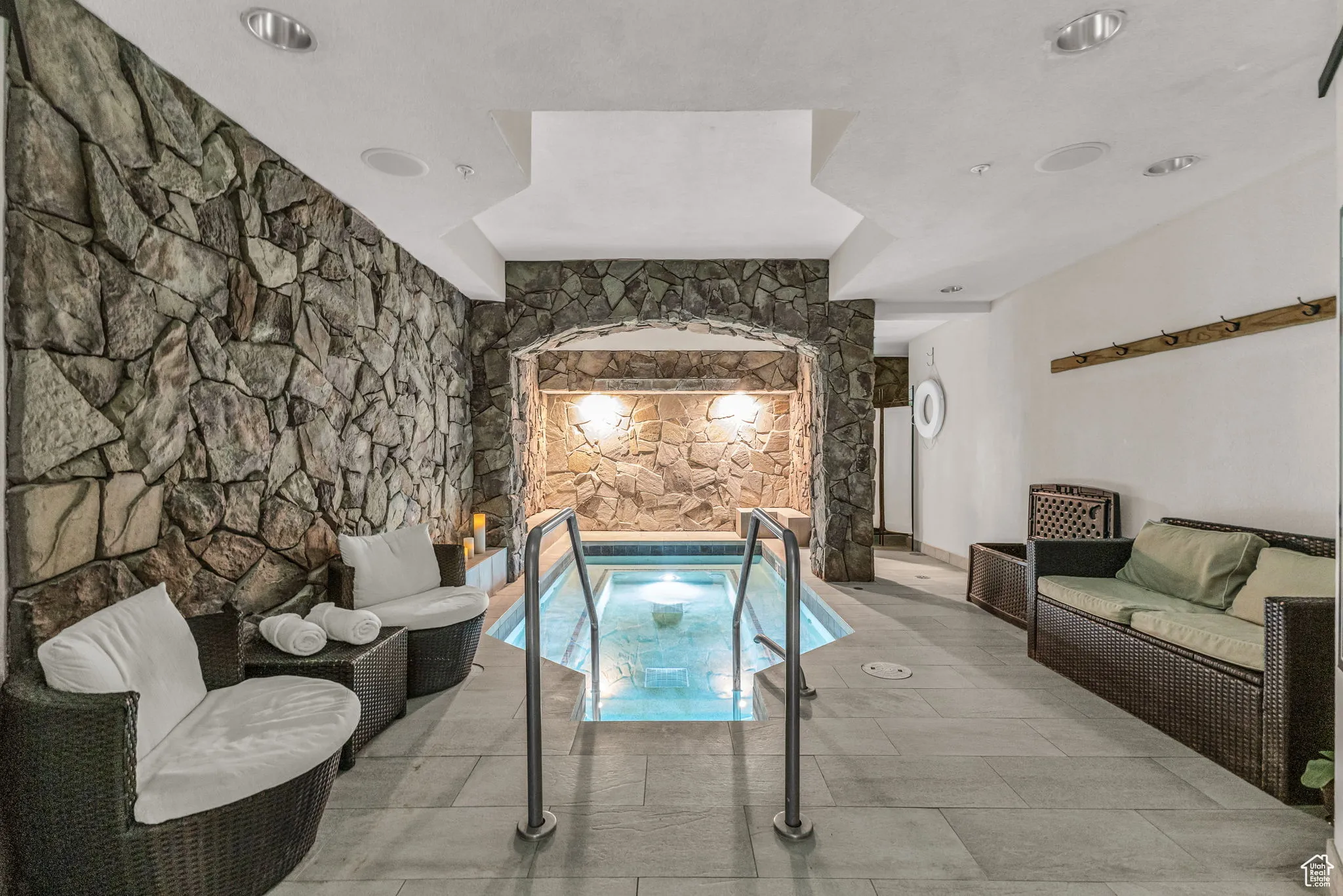 View of pool with a swimming pool and an in-ground hot tub