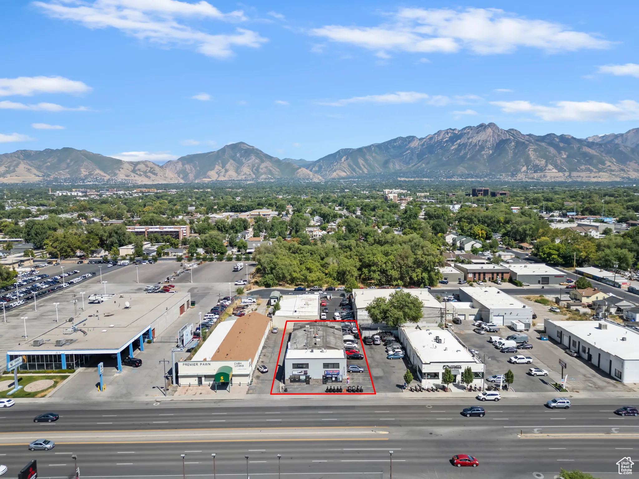 Aerial view of property's location featuring a mountainous background and property boundaries highlighted