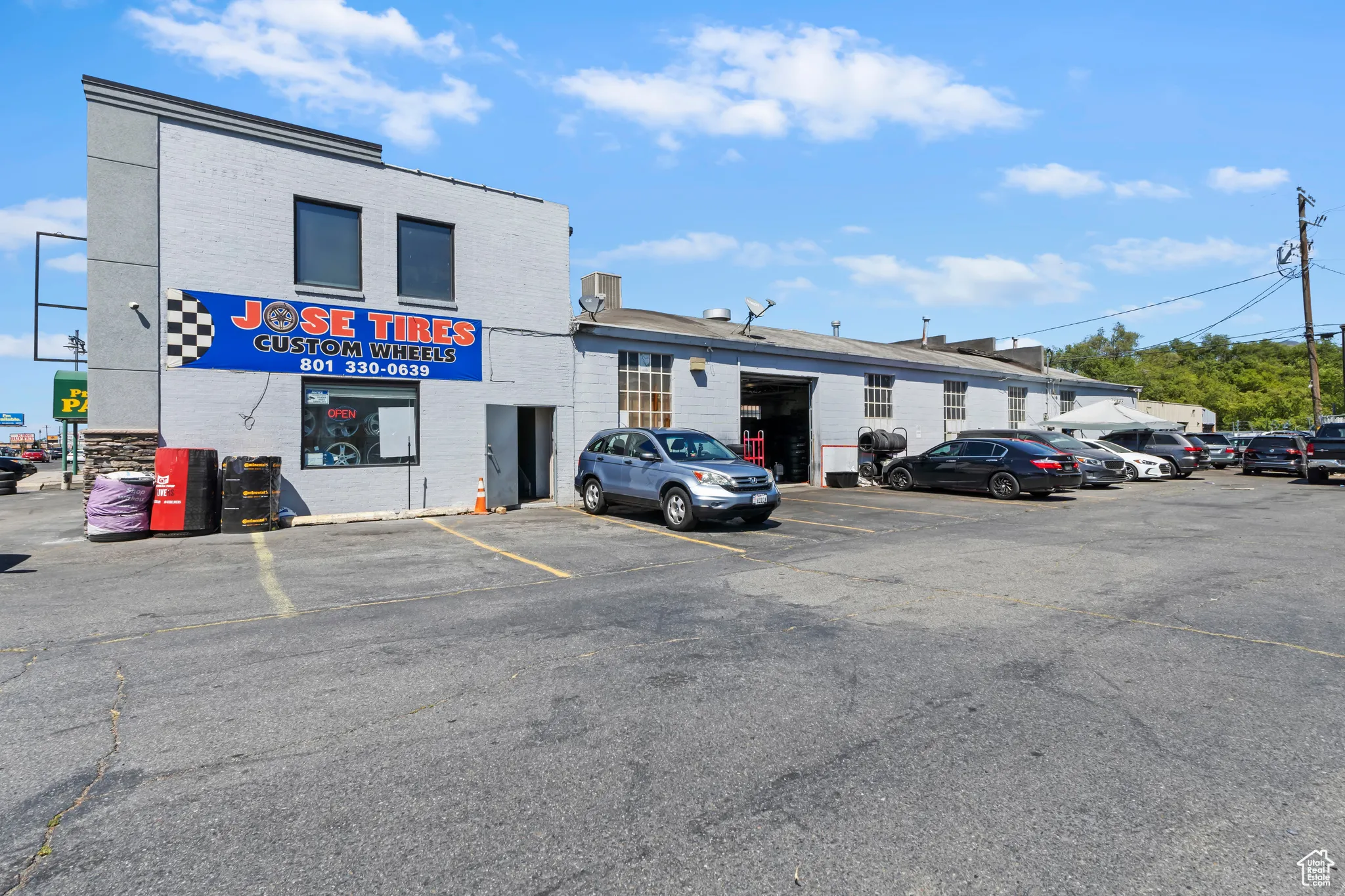 View of property with uncovered parking