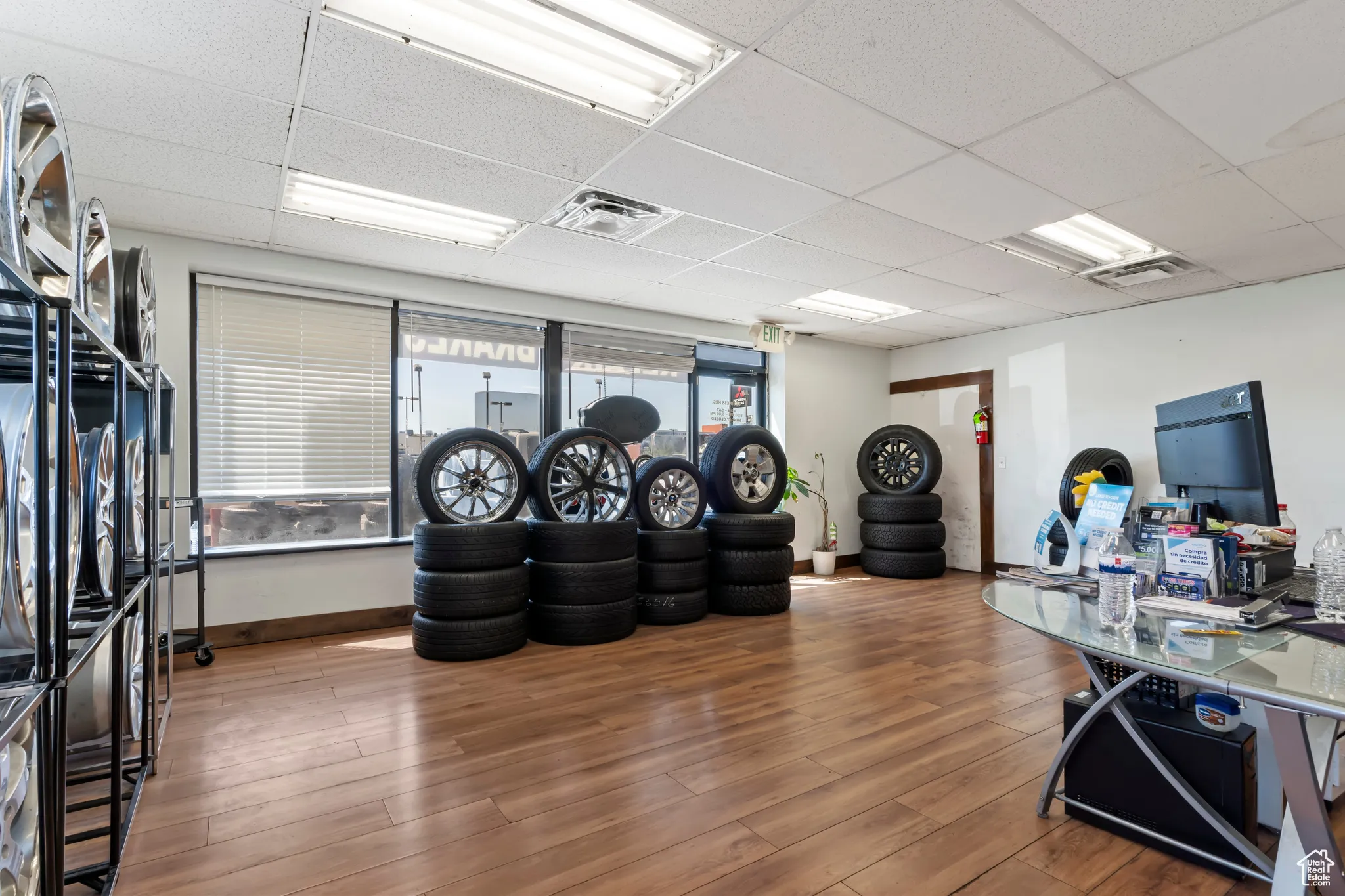 Office featuring a paneled ceiling and wood finished floors