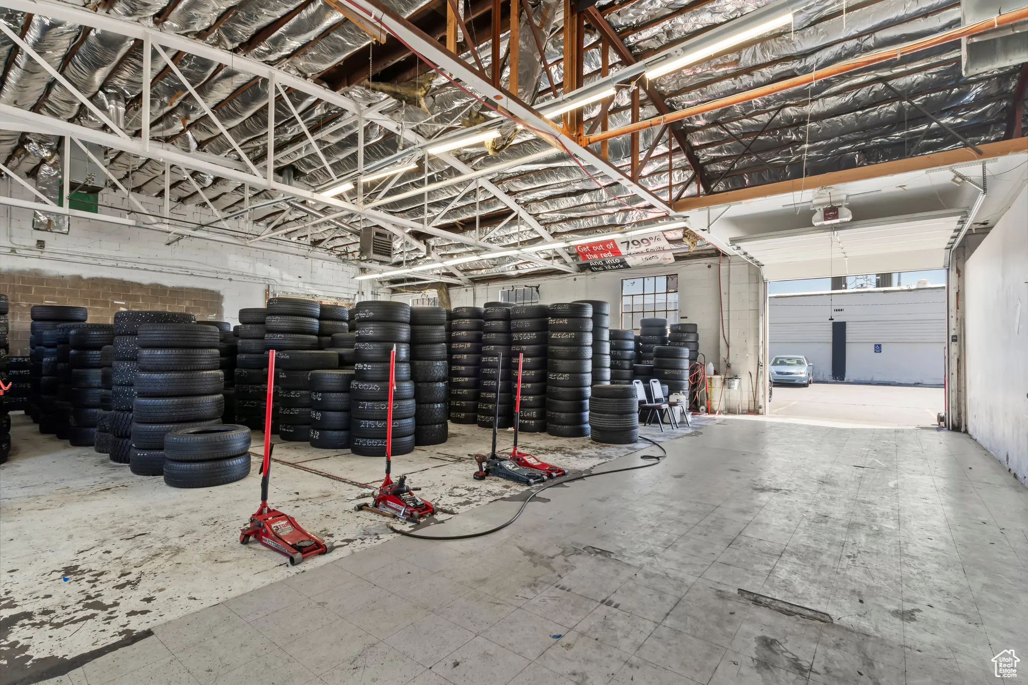 Garage featuring a garage door opener
