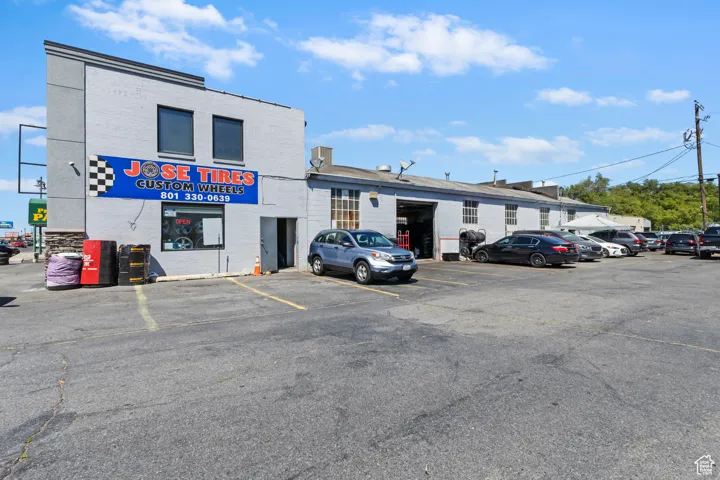 View of property with uncovered parking