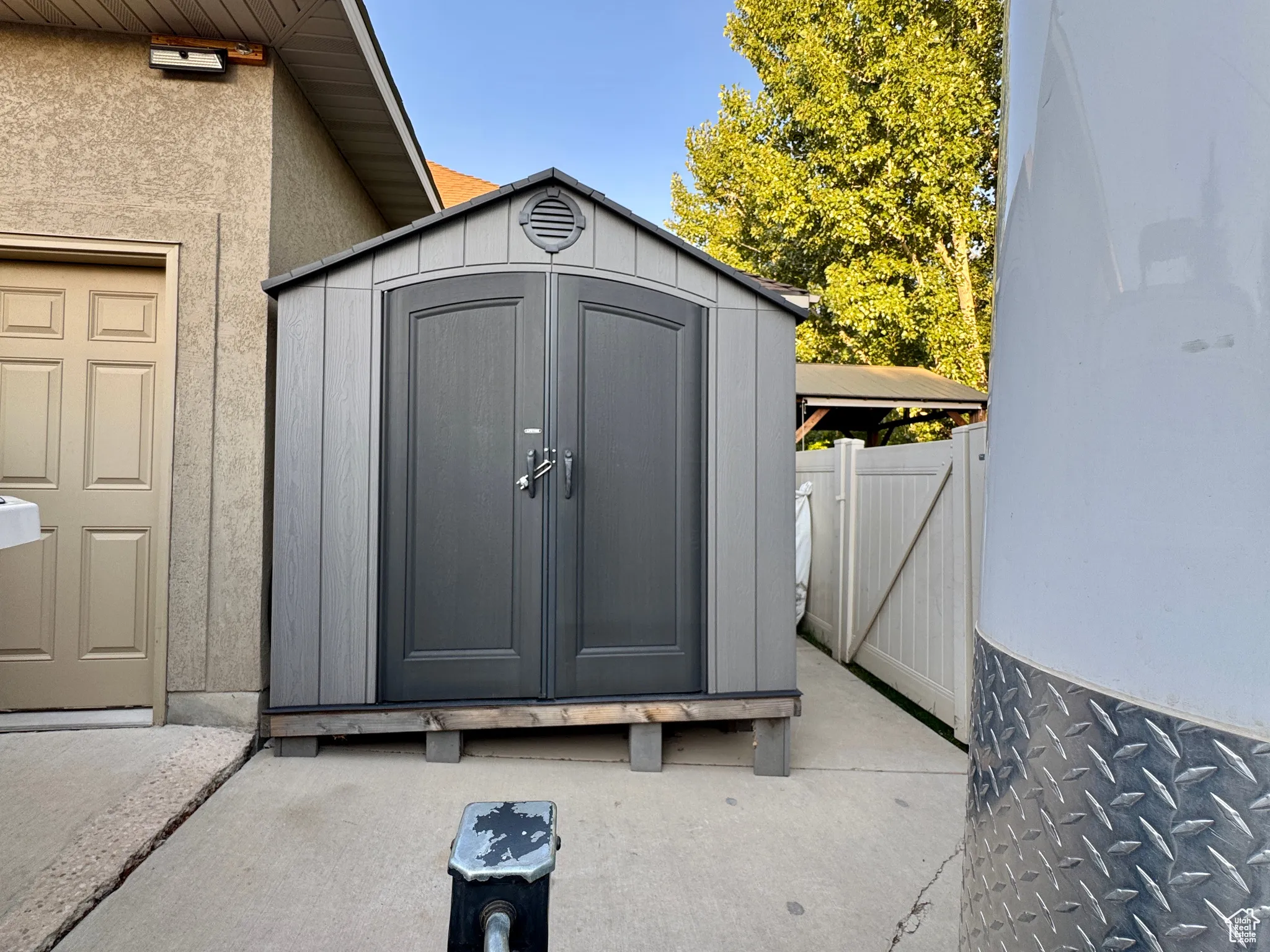 View of shed with a gate