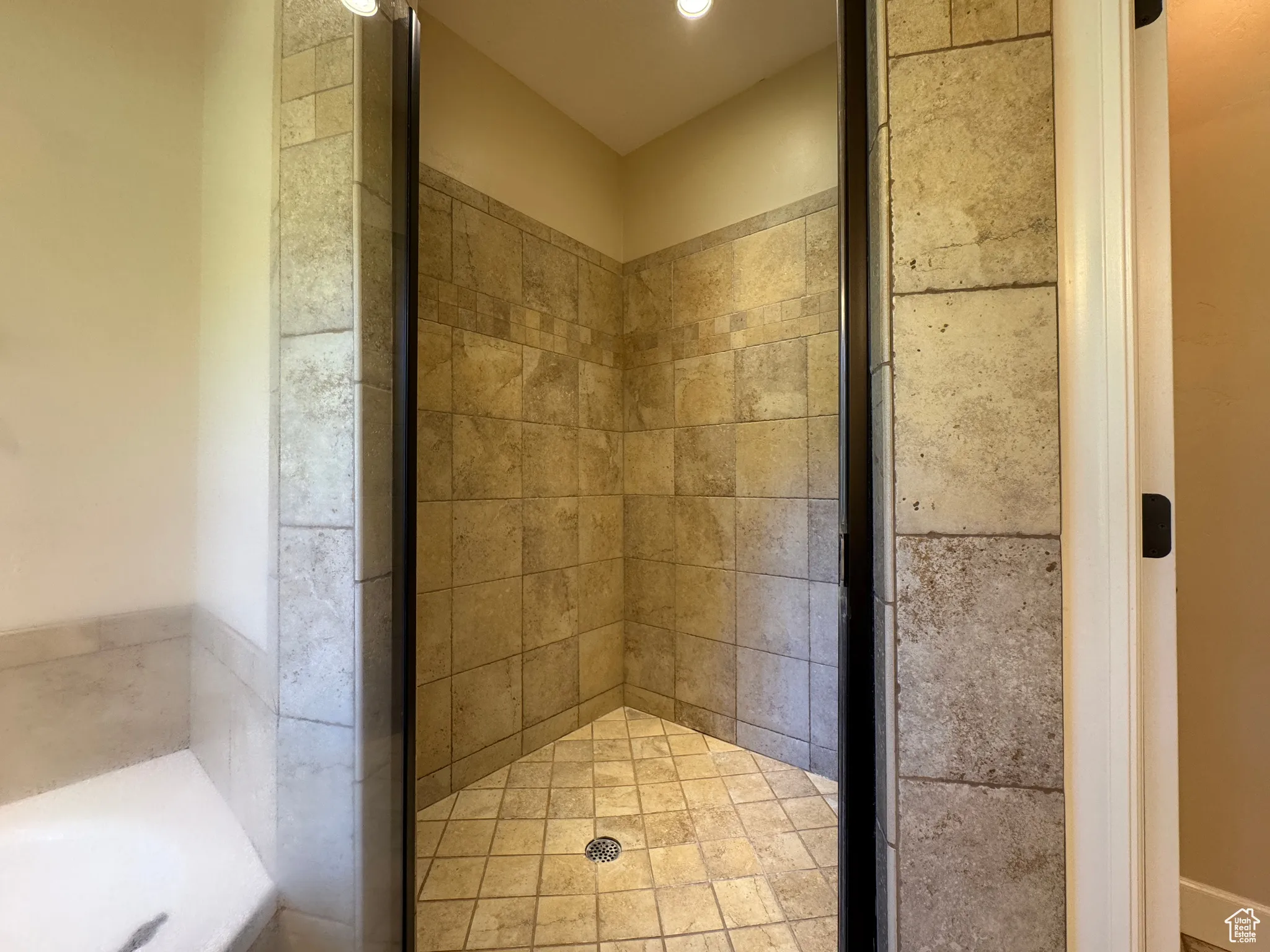 Full bath with a stall shower and a garden tub