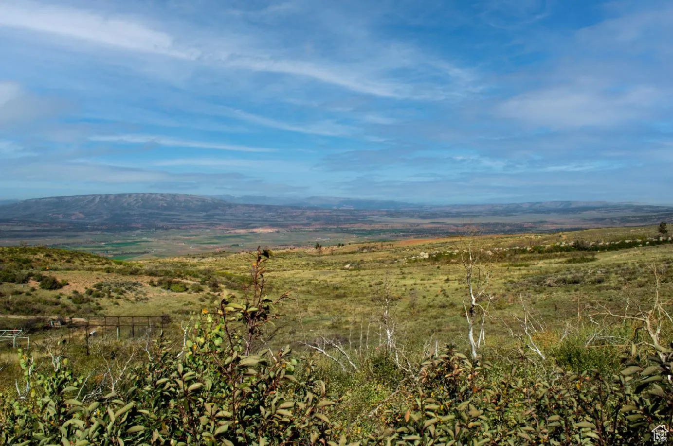 View of mountain background featuring rural landscape