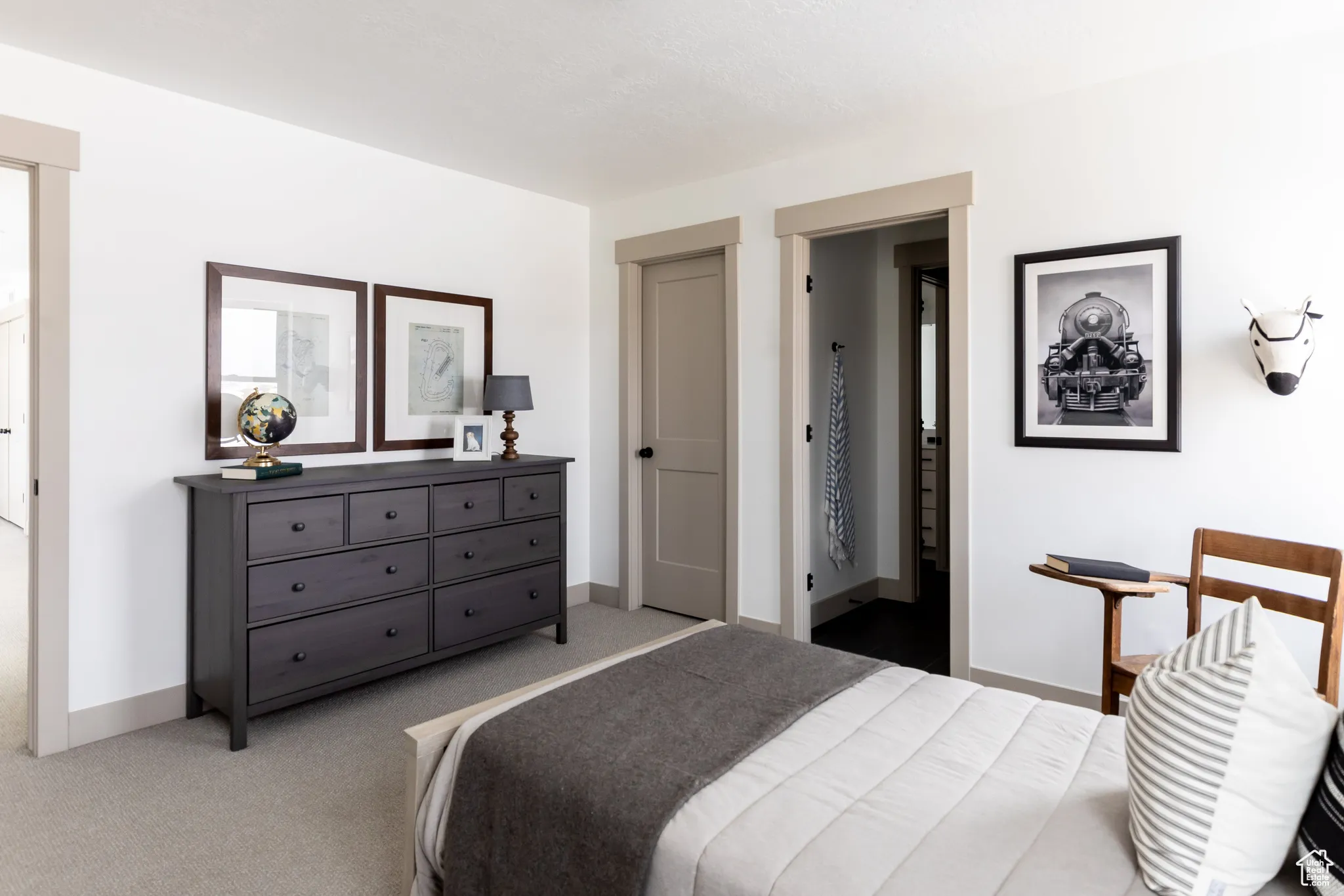 Bedroom featuring carpet floors and connected bathroom