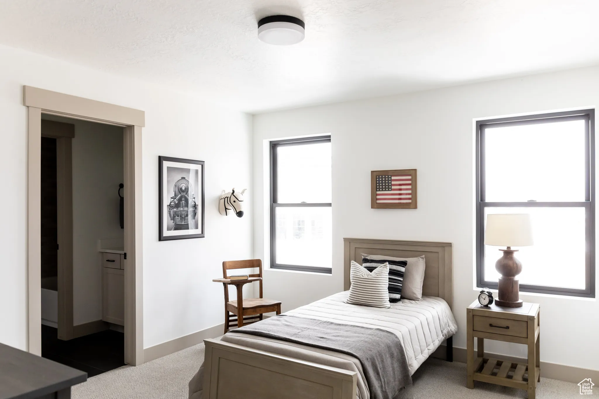 Carpeted bedroom featuring baseboards