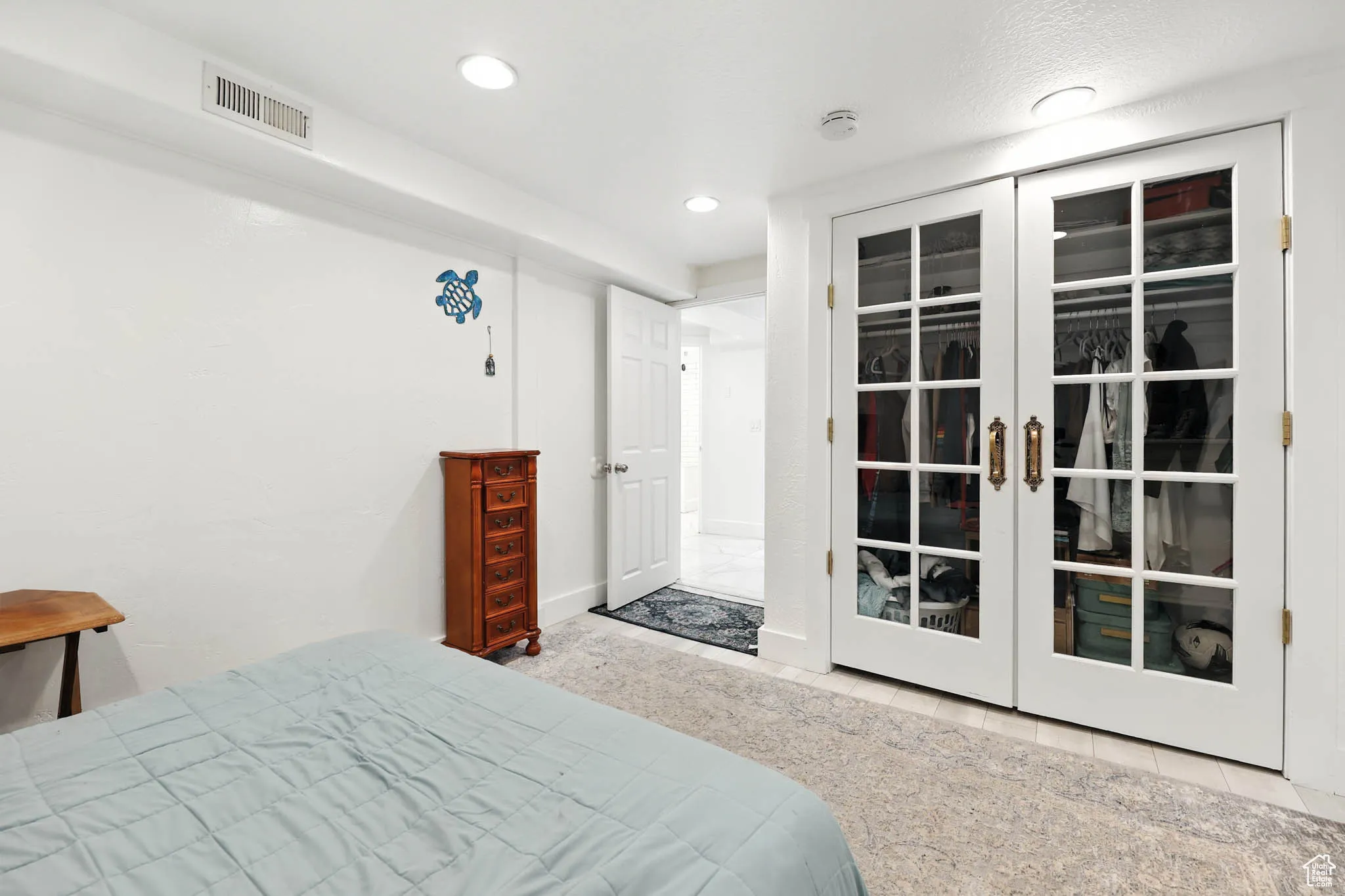 Bedroom with recessed lighting and french doors