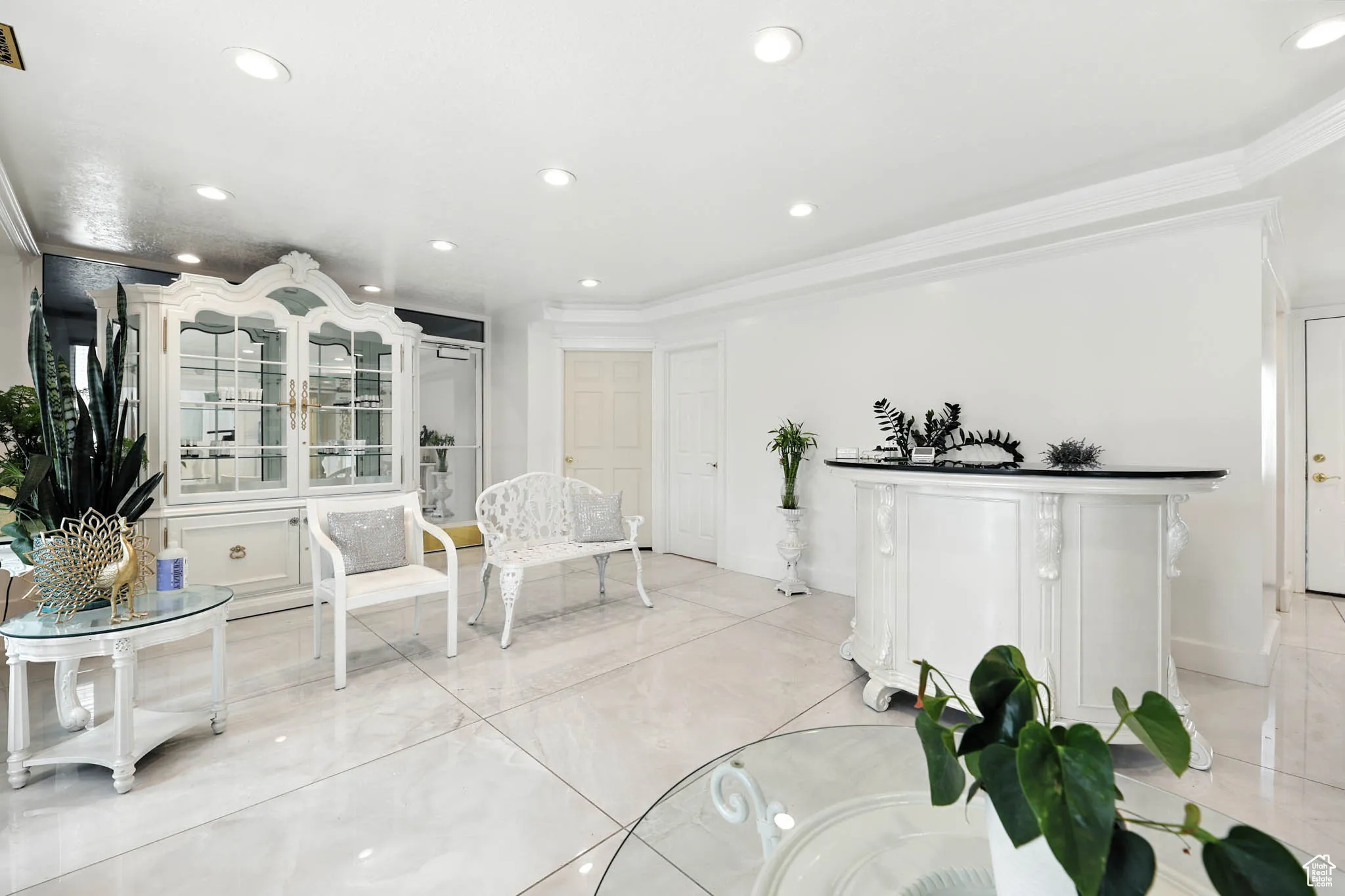 Living area featuring ornamental molding, recessed lighting, and tile patterned floors