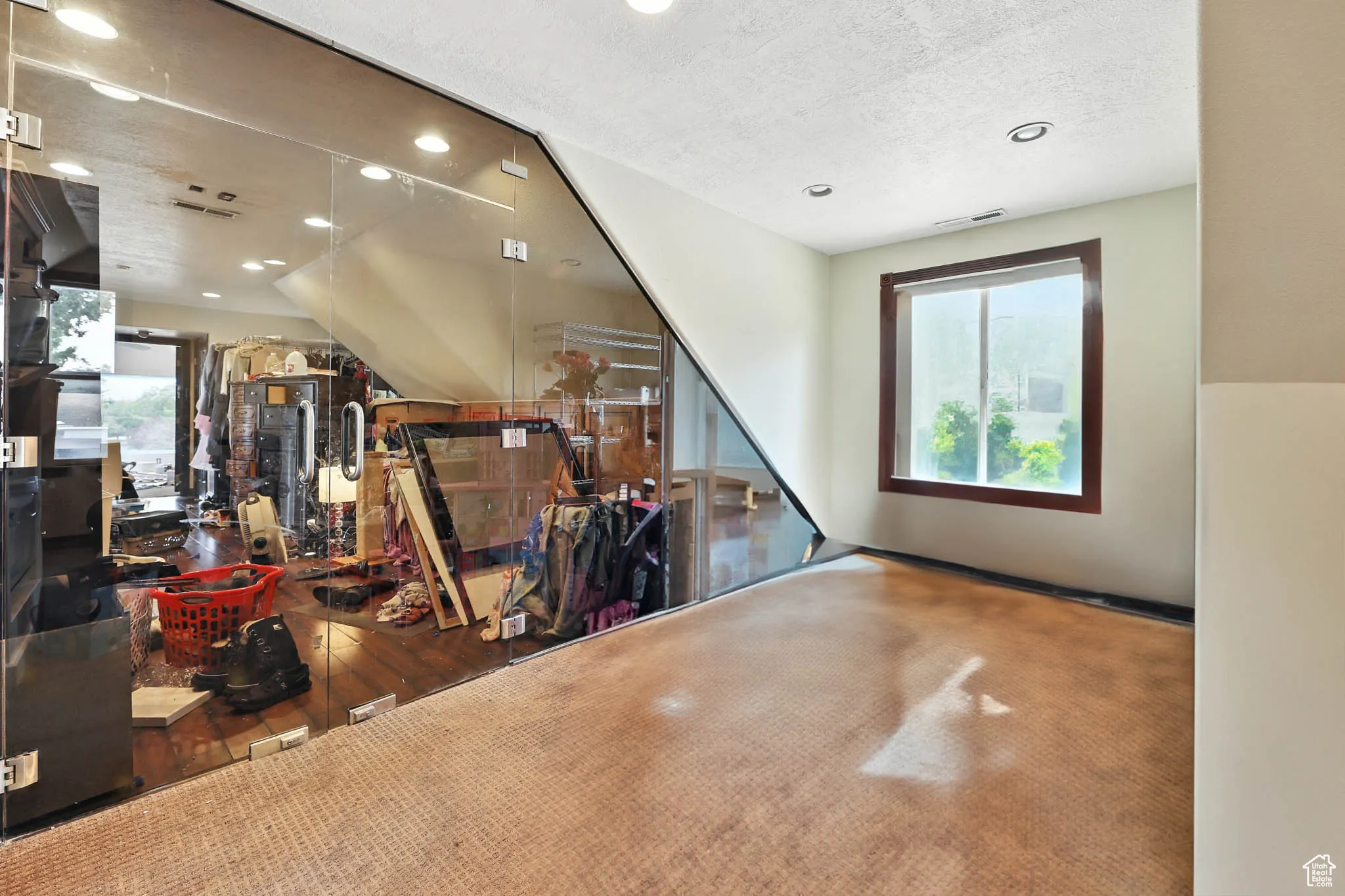 Bonus room featuring recessed lighting and a textured ceiling