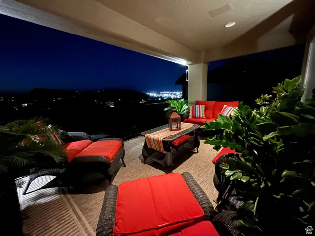 Patio at night with an outdoor hangout area and a patio area