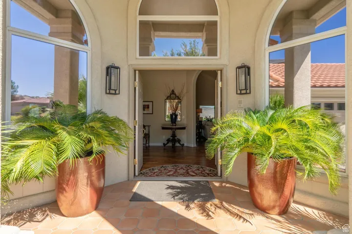 Entrance to property with stucco siding