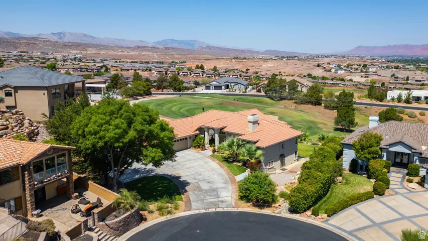 Aerial perspective of suburban area with a mountainous background