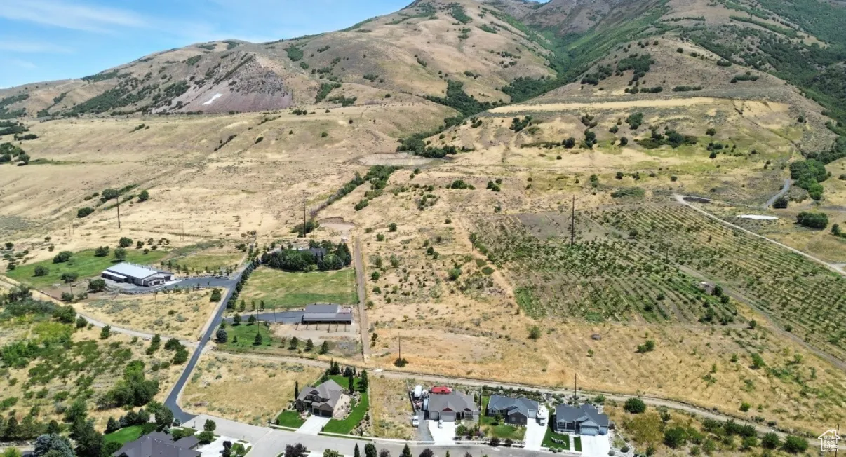 Aerial view of property's location featuring rural landscape and mountains