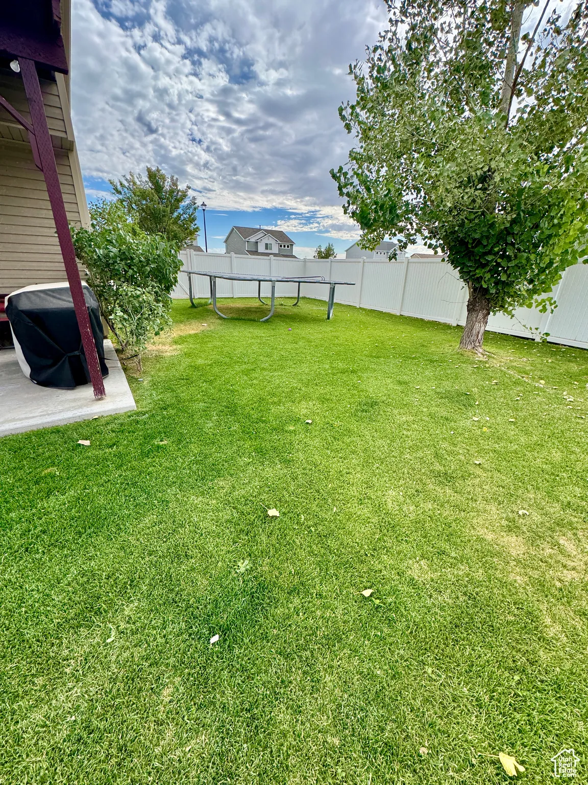 Fenced backyard featuring a patio area