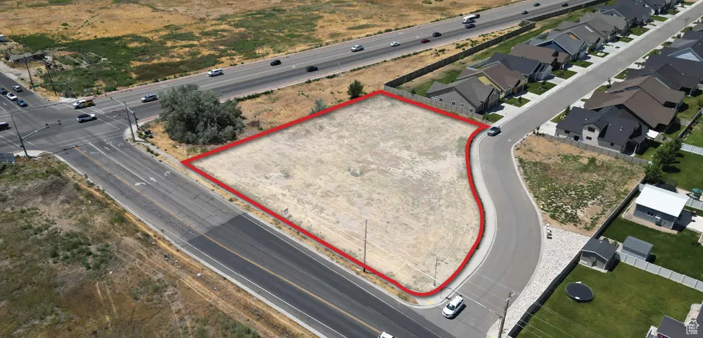 Aerial view of property and surrounding area with property boundaries highlighted