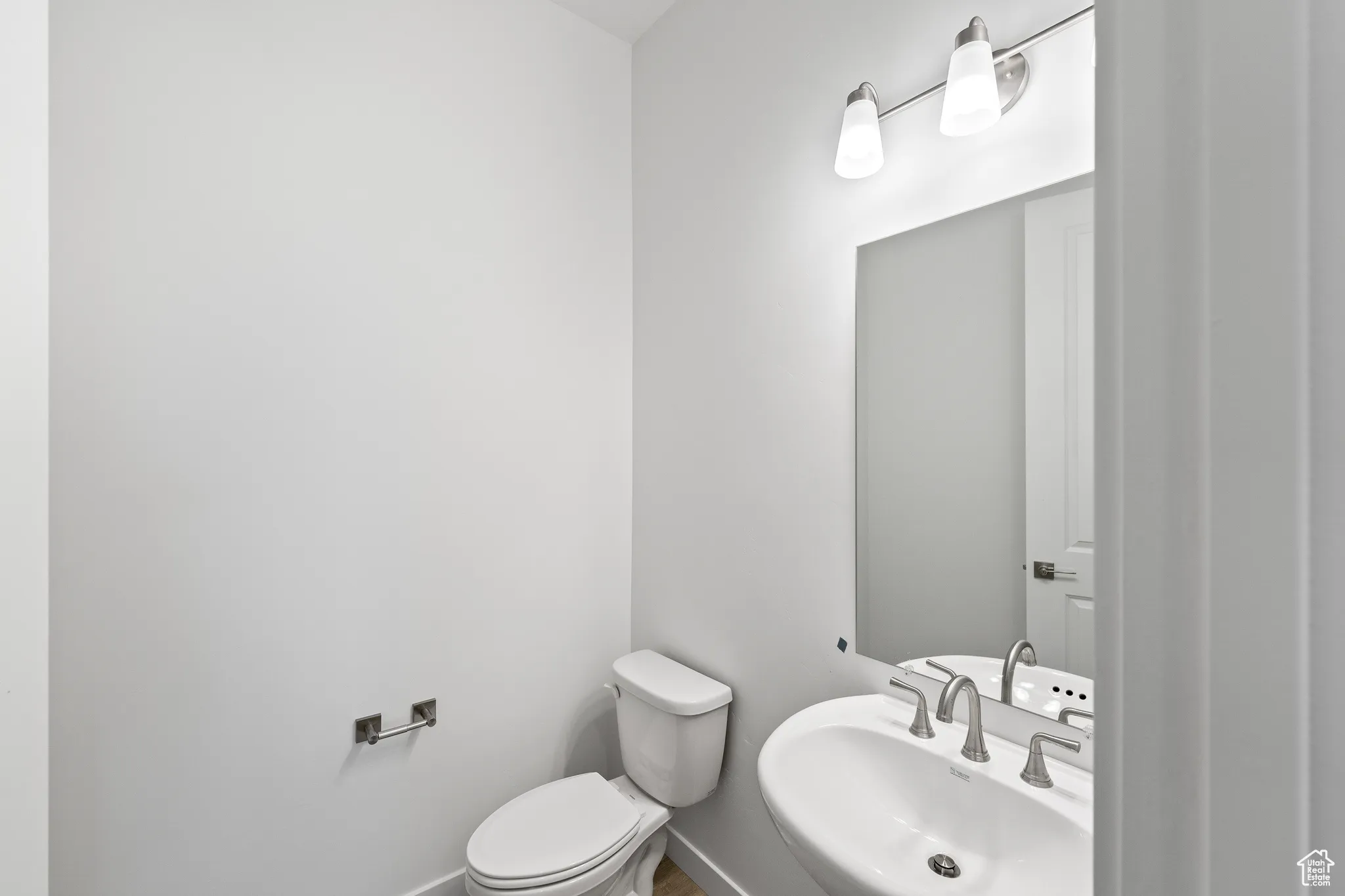Bathroom featuring a sink and toilet
