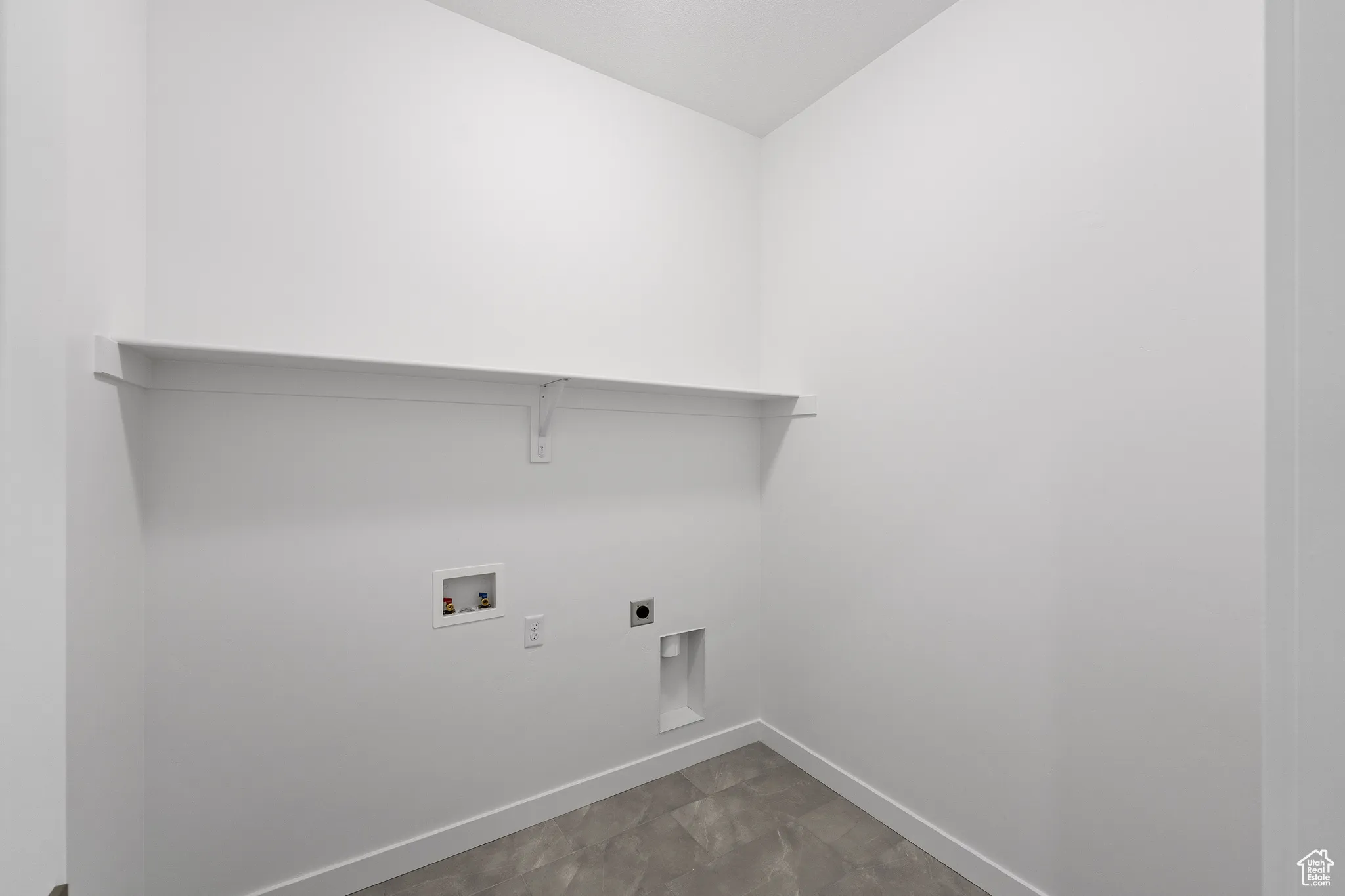 Laundry area featuring electric dryer hookup and hookup for a washing machine