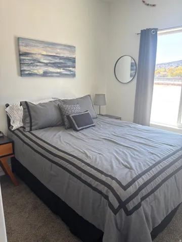 Bedroom with dark carpet